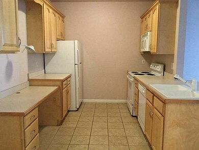 Kitchen. Plenty of cabinets and desk area