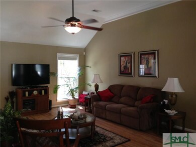 Vaulted ceilings and laminate flooring are the hal
