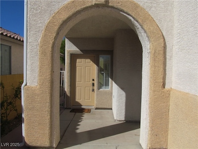 Doorway to property with stucco siding