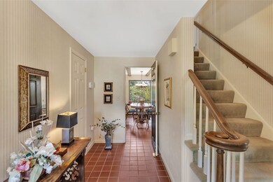FOYER FLOWS TO FORMAL AND INFORMAL AREAS