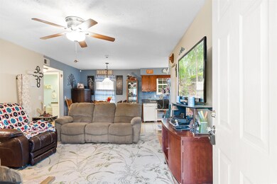 Living room featuring a textured ceiling and ceili