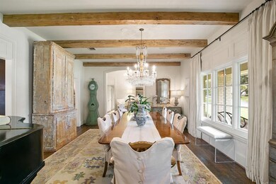 This fabulous dining room is large in scale. Hand 