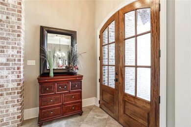 Gorgeous double doors, large entryway and brick ac