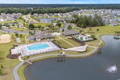 View of property location with nearby suburban area and a nearby body of water