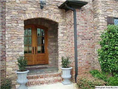 Welcoming, covered entrance with double doors and 