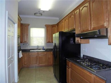 Kitchen. View of kitchen from living room.  5 burn