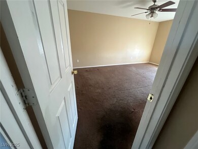 Unfurnished bedroom with baseboards, a ceiling fan