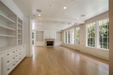 Breakfast Room with built-ins opens to Den