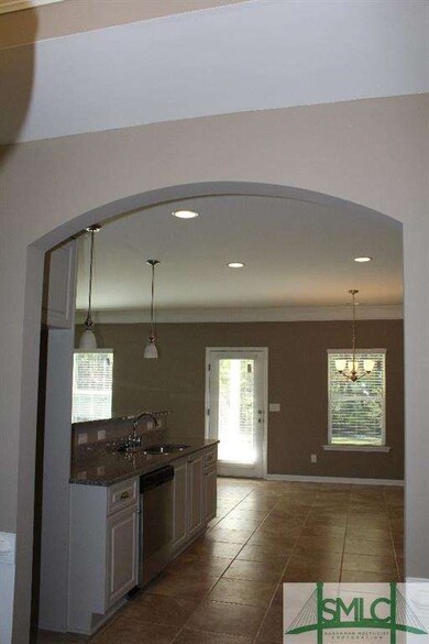 Arched opening from dining room to kitchen