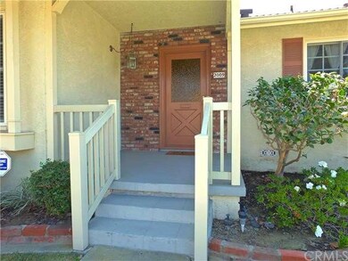 Cute front porch with vinyl railings and brick enh
