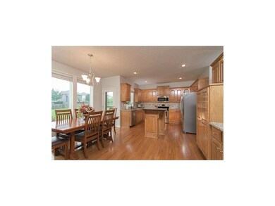 Large, open kitchen features granite countertops, 