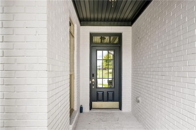 Property entrance with brick siding