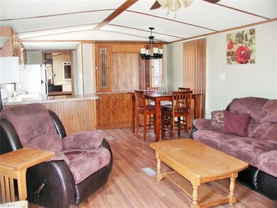 Living room w/new laminate flooring.  All furnitur