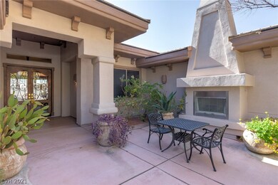 Front courtyard with gas fireplace and sitting are
