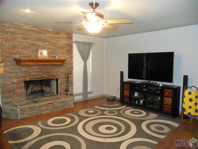 Nice size family room with wood burning fireplace.