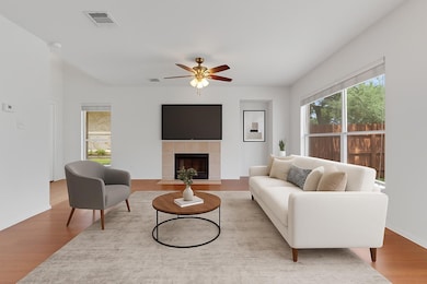 Living area with wood finished floors, a ceiling 