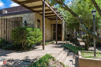 Pretty grounds surround this convenient townhome c
