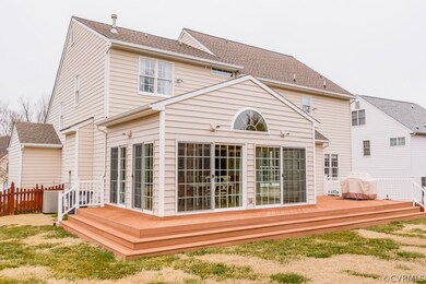 REAR EXTERIOR W/ COMPOSITE DECKING, PICKET FENCE,