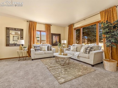 The formal living room is in the front of the home with tall ceilings, large windows for wonderful natural light