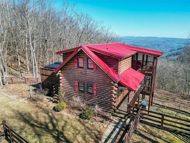 View of side of home featuring a mountain view and