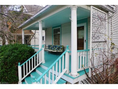 Large spacious front porch with iron privacy partition!