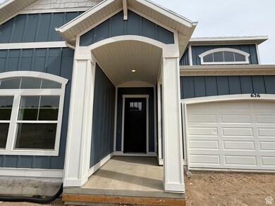 View of exterior entry with board and batten siding