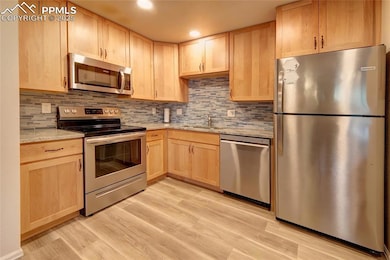 Renovated kitchen with new cabinets & granite counters