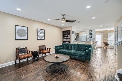 Living room featuring dark wood finished floors, 