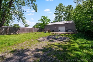 View of yard with an outbuilding and a garage