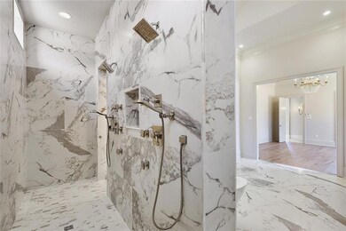 Spacious shower features dual heads.