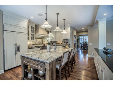 Custom cabinetry featuring decorative glass panel 