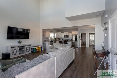 Two story ceilings. Open to kitchen.