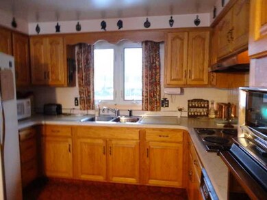 Kitchen. Stainless double sink and window overlook