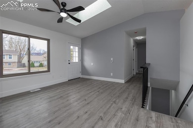 Unfurnished living room featuring light wood-type 