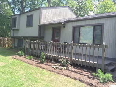 You enter the home on this nicely sized front deck .