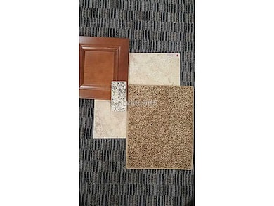 Property Photo. cabinets, granite, tile, & carpet