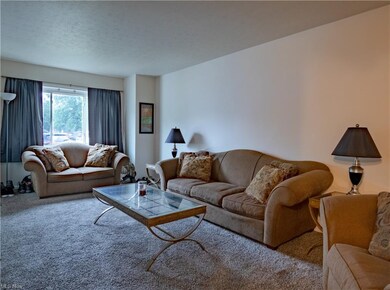 The large living room is decorated in neutral tone