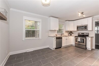 New porcelain tile floors, cool gray walls, crown 