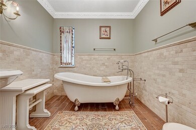 Full bathroom featuring wood-type flooring, a free
