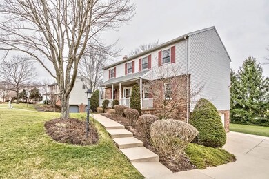 2 Car Side Entry Garage with cement pathway to the Rear Yard Step-Down Entertaining Deck & Finished Walkout Gameroom Patio
