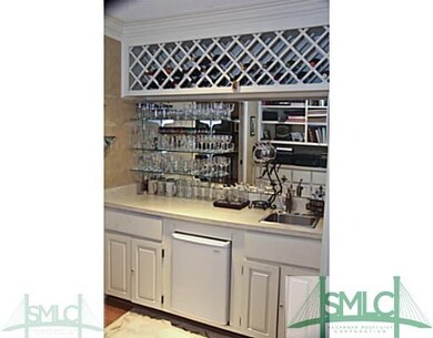 Other. The wet bar has a sink, refrigerator, and p