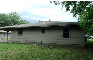 View of property exterior featuring a yard