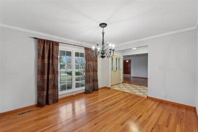 Dining room features hardwood floors.