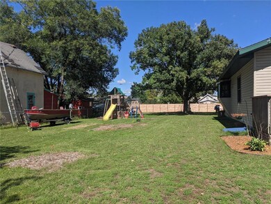 Double city lot, plenty of room here for activitie