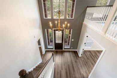 Foyer opens up to second floor for an impressive,