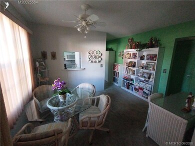 Dining area on left with pass-thru kitchen opening