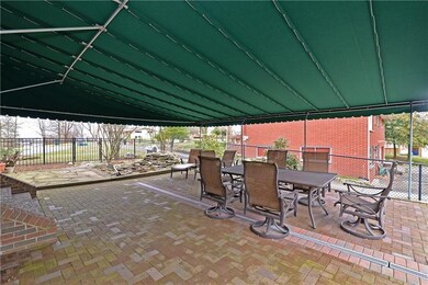 Private, totally redone 700 SF brick patio w/ inte