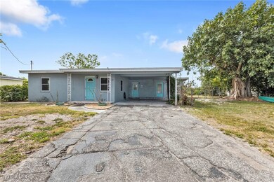 Single story home featuring a front yard, stucco s