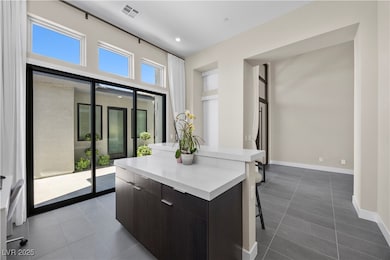 The bright and airy den can serve as an office or
