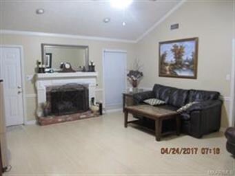 FAMILY ROOM FEATURES A GAS LOG FIREPLACE